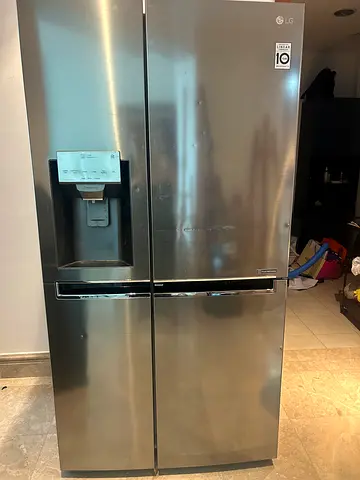 LG Stainless Steel Side-by-Side Refrigerator with Water Dispenser