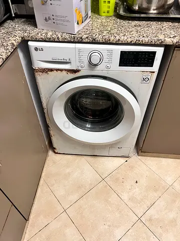 LG Front Load Washing Machine - Used, working perfectly but (rust around base)