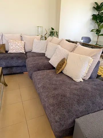 Grey two-seater sofa in good condition