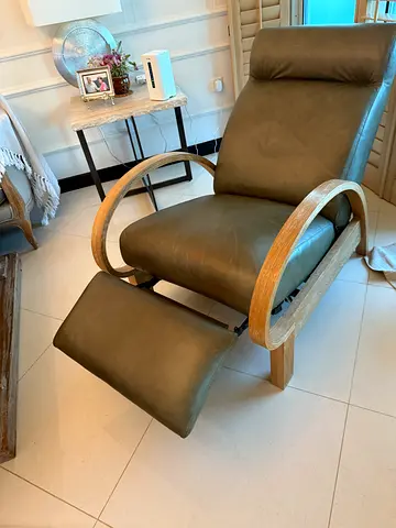 Leather reclining armchair with matching ottoman and wooden arms
