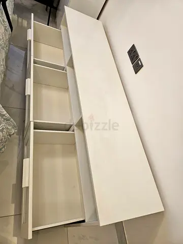 White low storage cabinet with three drawers — good condition