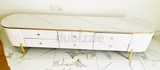 Long white marble-effect TV cabinet with gold legs and 6 drawers