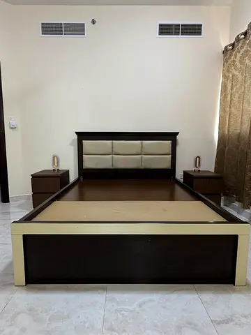 Queen wooden bed frame with two matching nightstands - dark wood and cream