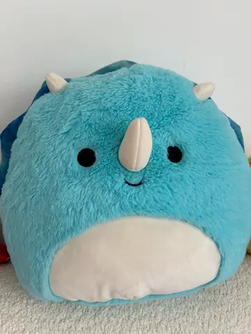Soft blue triceratops plush toy - gently used