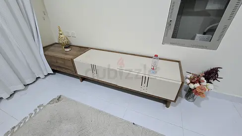 Low modern TV cabinet with storage - light wood and white finish