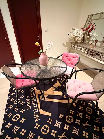 Glass Top Dining Table with 4 Cushioned Metal Chairs — Good Condition