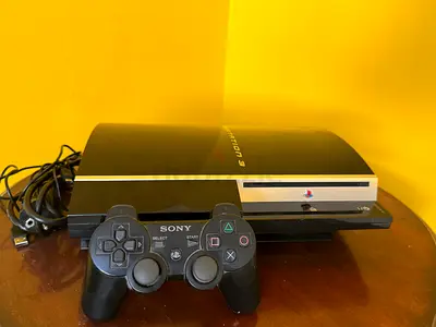 Sony PlayStation 3 (PS3) Slim with DualShock Controller - Good Condition