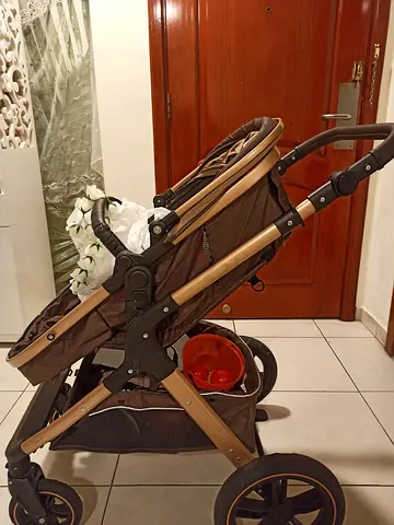 Well-used standard pram stroller with storage basket - brown/gold