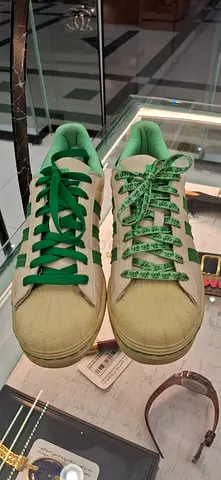 Light green low-top sneakers, gently used pair