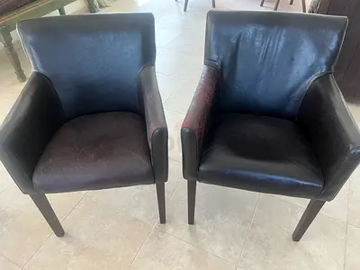 Pair of dark brown faux leather dining/armchairs -  average condition