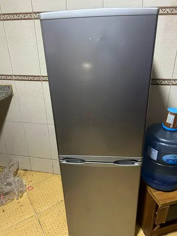 Silver two-door refrigerator - good working condition