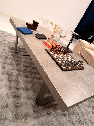 Modern concrete-look coffee table with metal legs - good condition