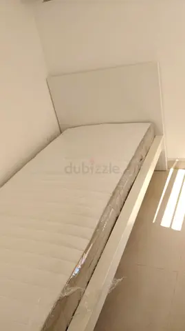 Ikea Single white bed frame with mattress and storage boxes