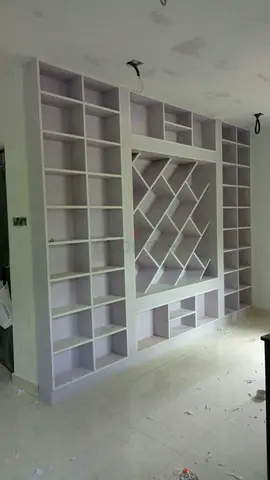 Custom Built-in Wall Shelving Unit with Geometric Display Center