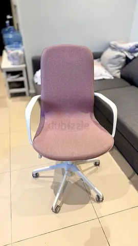 Comfortable pink fabric IKEA swivel office chair with armrests
