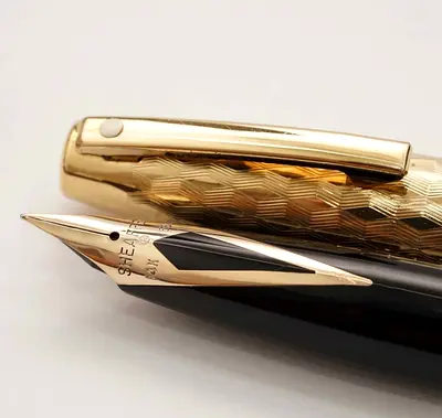 Vintage SHEAFFER 23kgold plated body with 14 k nip  .