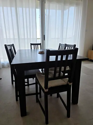 Dark wood 6-seater extender dining table with chairs - good condition