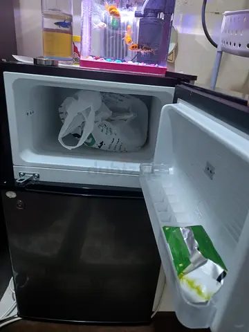 Small double-door mini fridge in good working condition