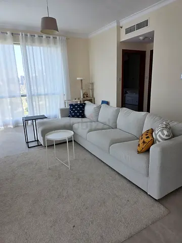 Light grey L-shaped sectional sofa with cushions – good condition