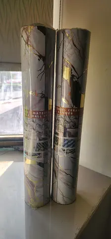 Two rolled modern marble-pattern wall stickers – brand new, unopened. Can put around Ac 2pcs