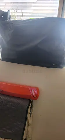 Large Black Waterproof Dry Bag for Camping over Car to be attached with straps to tie on roof.