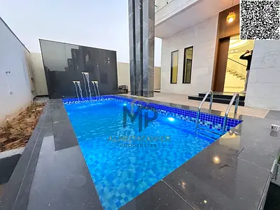 For sale: Luxurious modern villa with 4 master bedrooms and a spacious yard in Ajman, including reg