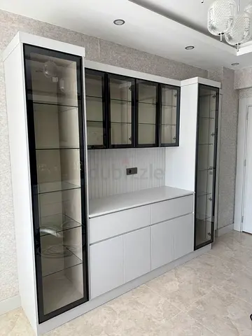 White Built-in Display Cabinet with Glass Doors and Storage Drawers