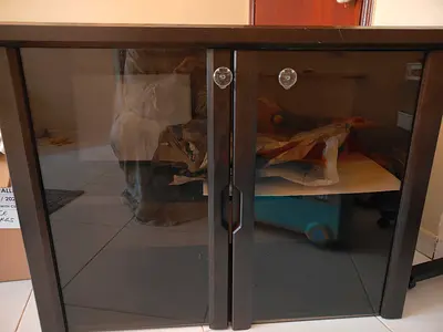 Solid wood cabinet with glass doors for urgent sale
