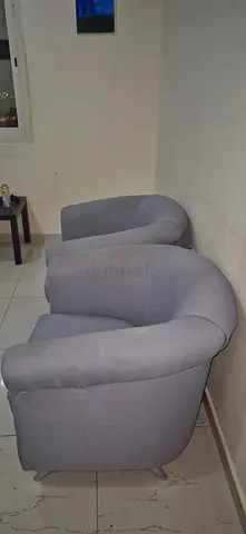 Pair of light grey upholstered armchairs — good condition