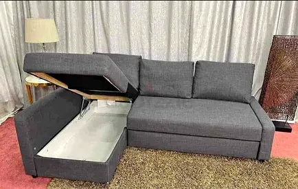 Grey L-shaped Sofa with Storage and Pull-out Bed — Good Condition