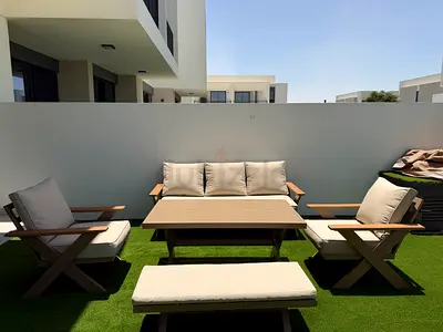 Outdoor 4-piece patio seating set with coffee table - beige cushions