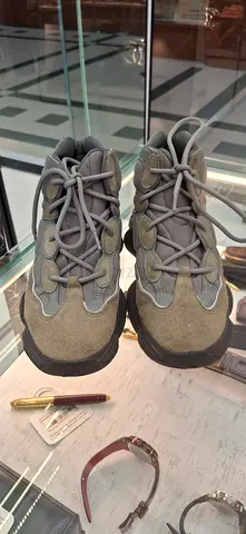 Pair of grey-green casual sneakers, lightly used