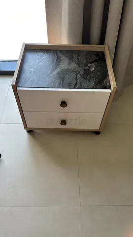 One bedside table with faux marble top