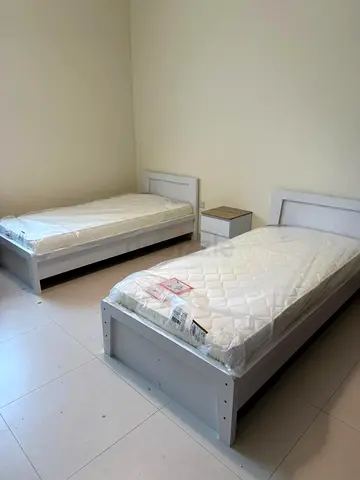 Pair of single white wooden beds with nightstand - good condition