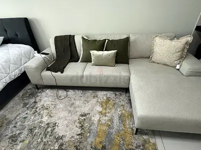 Beige L-shaped fabric sofa with cushions (good condition) from Pan Home
