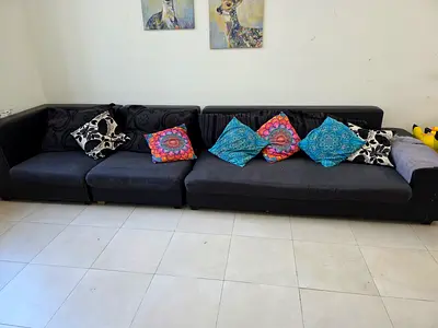 Five-seater black fabric and faux-leather sectional sofa - good condition