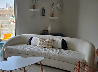 Cream Curved 3-Seater Sofa in Good Condition. Not even a year old.