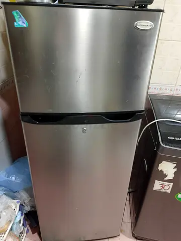 Silver double-door refrigerator in good working condition