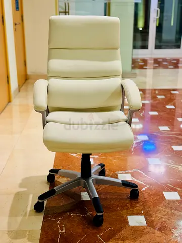Cream ergonomic office chair with high back and armrests — good condition