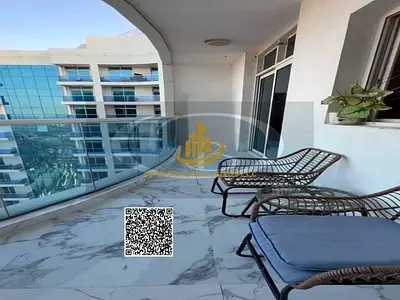 A bedroom and living room with a stunning sea view and furnishings in one of the best towers in Ajm
