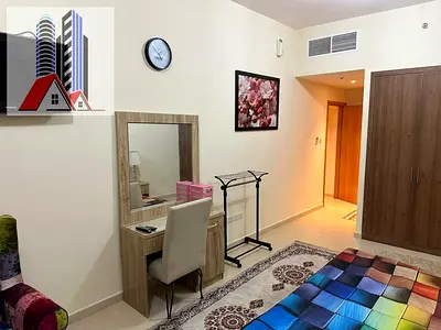 Furnished 2-bedroom apartment with living room for monthly rent in Ajman One Towers - Al Rashidiya
