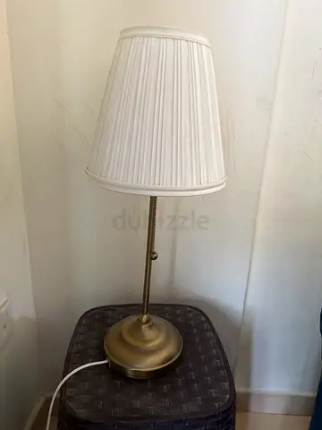 Classic brass table lamp with pleated white shade