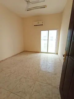 location with easy access to Dubai &amp; Sharjah). Type: Spacious Studio (Separate Kitchen + Balcony