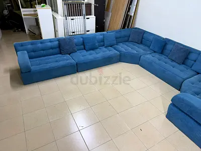 Blue sectional sofa with a modern, low design