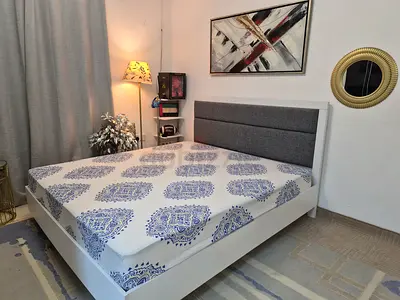 White Wooden Double Bed with Padded Headboard (King size mattress) - Good Condition