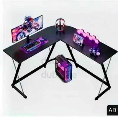 Black L-shaped gaming desk payed 300 aed(2 available)