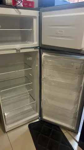 Compact top-freezer refrigerator in good working condition
