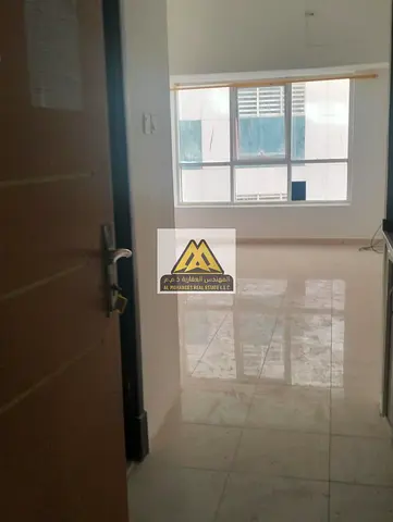 Studio for Annual Rent in Pearl Towers Al Rashidiya 1 Ajman with Spacious Layout and Semi-Separate Kitchen