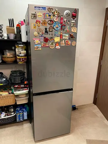 Silver bottom-freezer refrigerator in good working condition