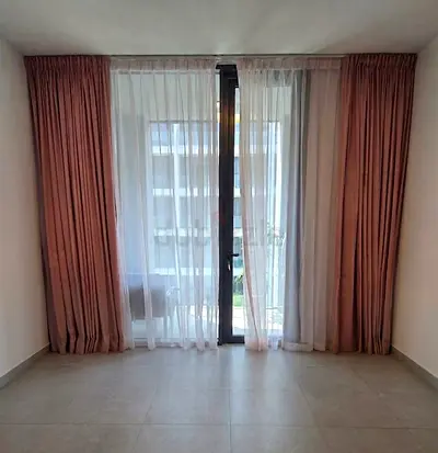 Pair of Full-Length Pink Fabric Curtains with Sheer Netting